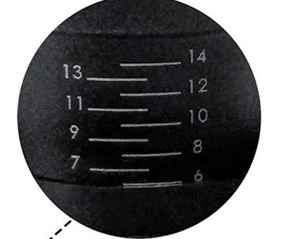 Close-up of the tamper's adjustment collar showing engraved graduations from 6 to 14