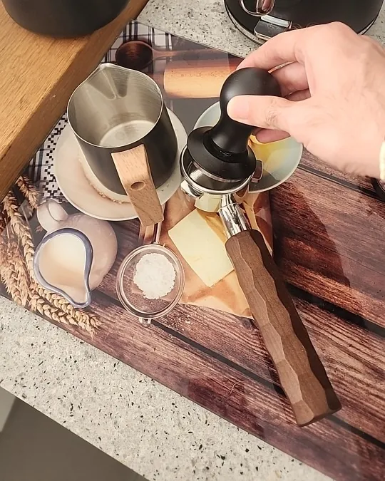 Calibrated coffee tamper photographed at home by a verified buyer — Rounded 53mm 54mm
