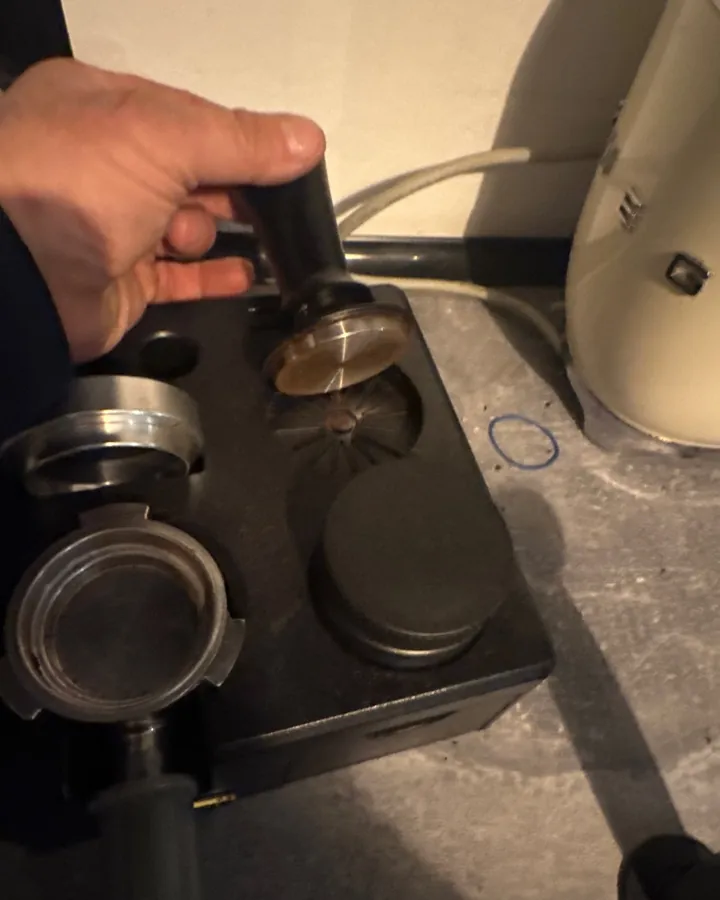 Calibrated coffee tamper photographed at home by a verified buyer — Straight 51mm