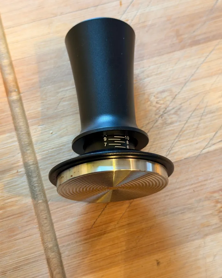 Calibrated coffee tamper photographed at home by a verified buyer — Straight 51mm