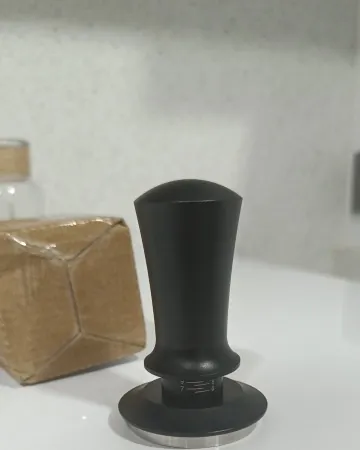 Calibrated coffee tamper photographed at home by a verified buyer — Straight 51mm