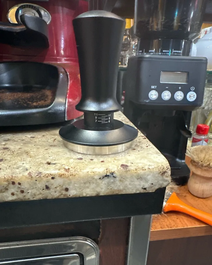 Calibrated coffee tamper photographed at home by a verified buyer — Straight 58mm