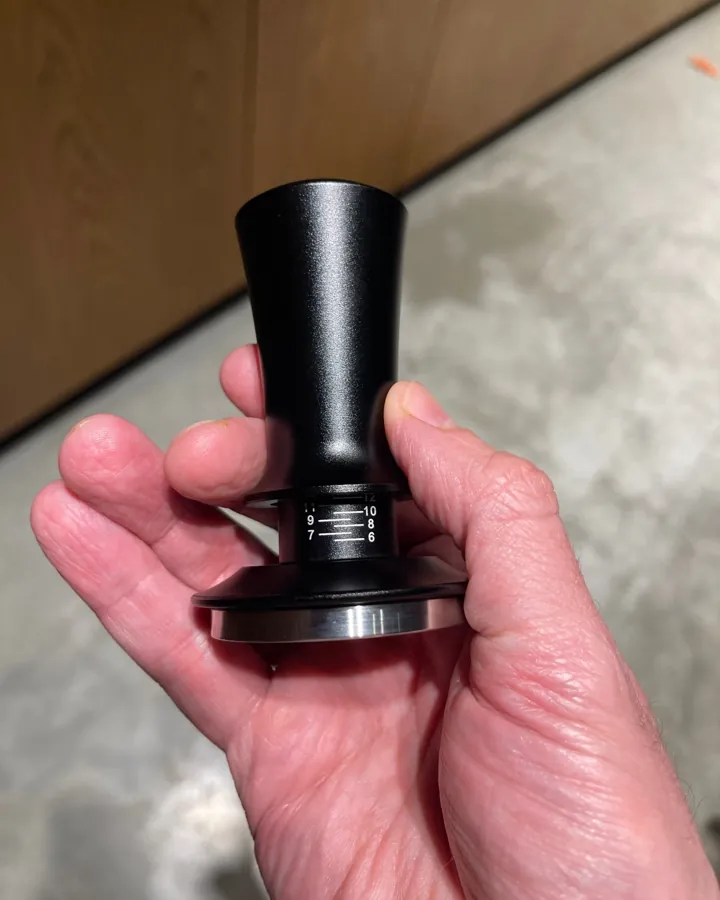 Calibrated coffee tamper photographed at home by a verified buyer — Straight 51mm