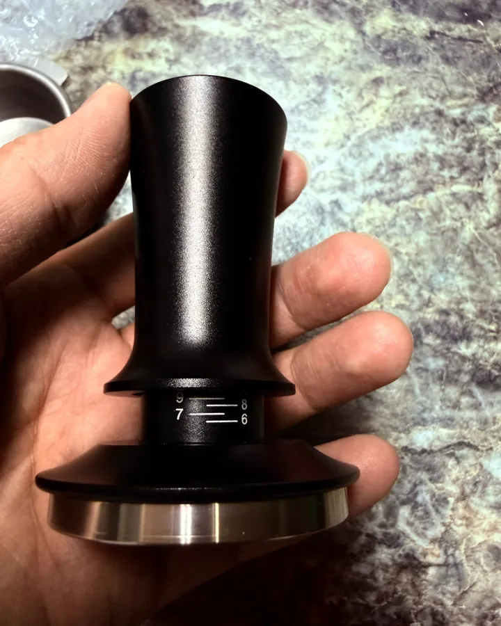 Calibrated coffee tamper photographed at home by a verified buyer — Straight 53mm 54mm