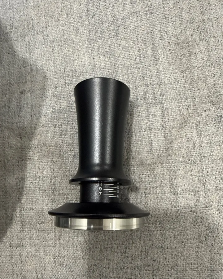 Calibrated coffee tamper photographed at home by a verified buyer — Straight 51mm